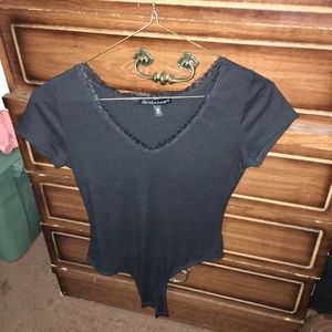 black thong bodysuit with lace on the chest area